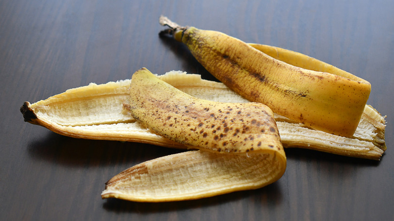 A banana peel on a wooden table