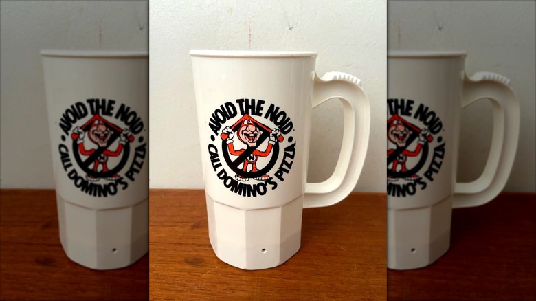 Domino's Avoid the Noid cup, showing the red Noid mascot