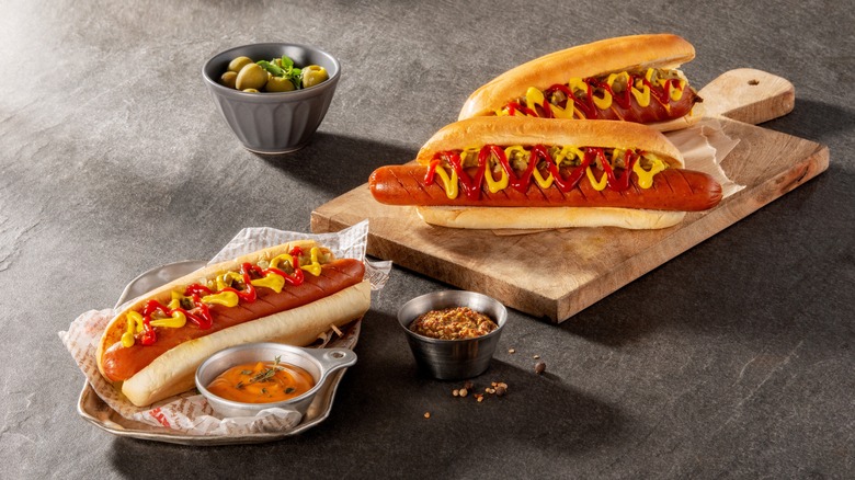 grilled hot dogs in buns with mustard and ketchup