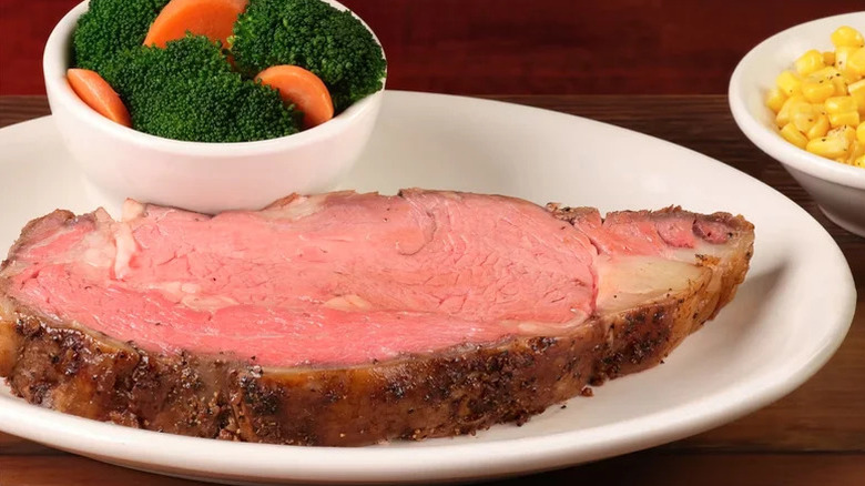 Texas Roadhouse prime rib with broccoli, carrots, and corn
