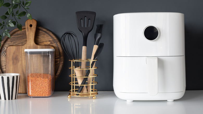 a small white air fryer on a kitchen counter