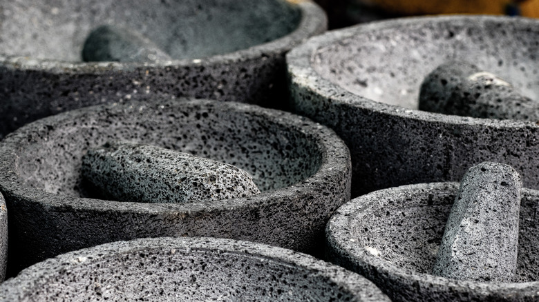 Several empty molcajetes beside one another