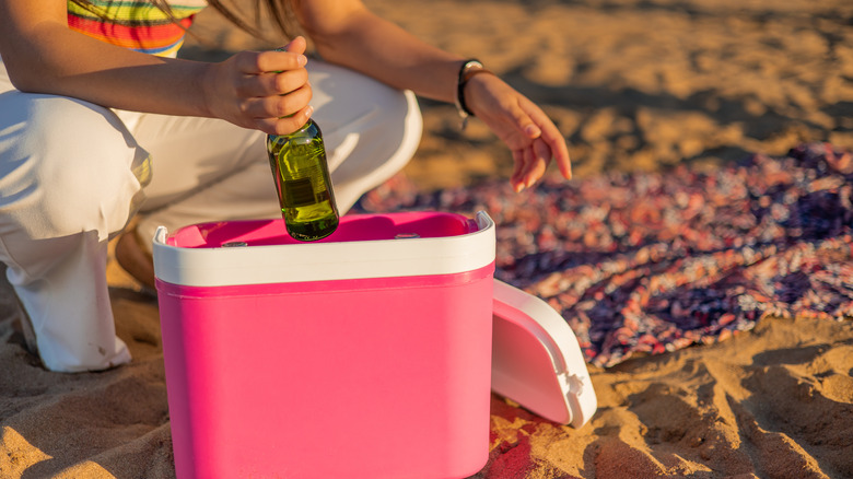 Pink cooler in the sand
