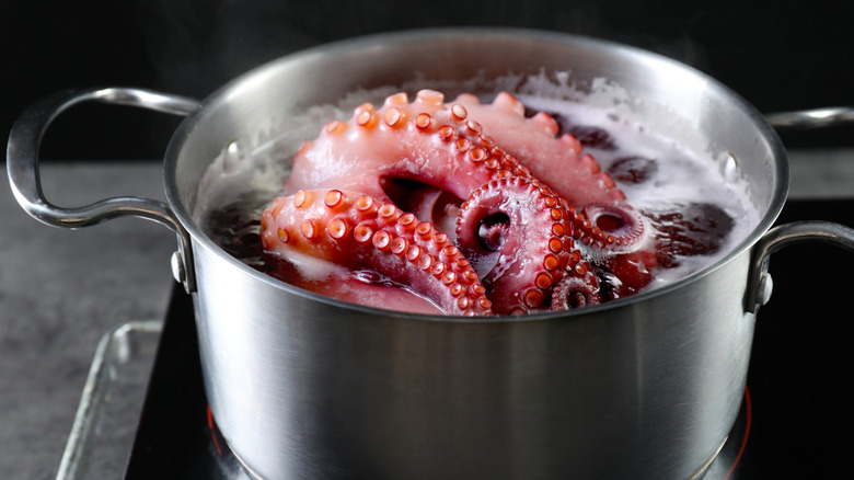 An octopus in a boiling pot of water.