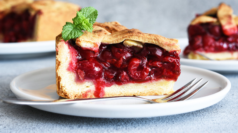 A slice of cherry pie on a plate