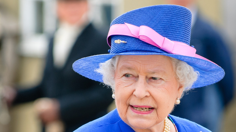 close-up of queen elizabeth wearing a blue hat