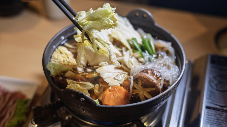 Japanese hot pot filled with Napa cabbage and other veggies