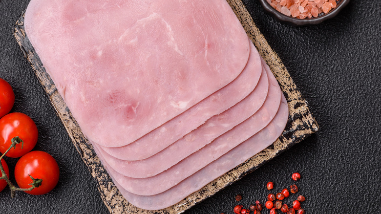 A board with square slices of bologna