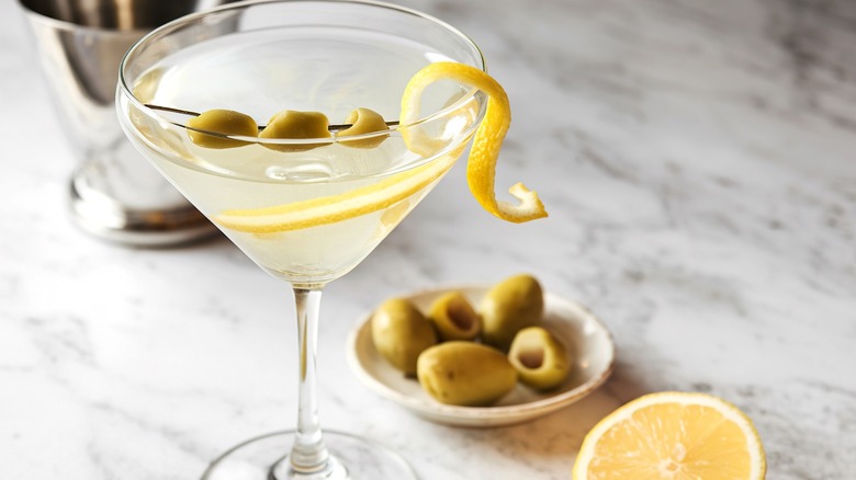 martini with olives and lemon twist