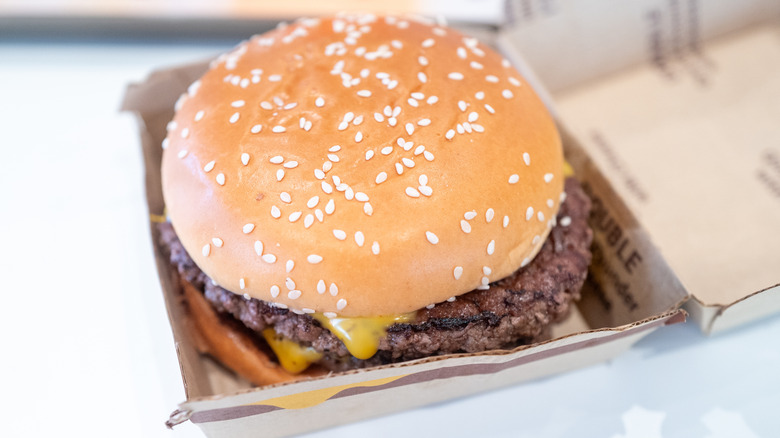 A McDonald's burger inside its cardboard box.