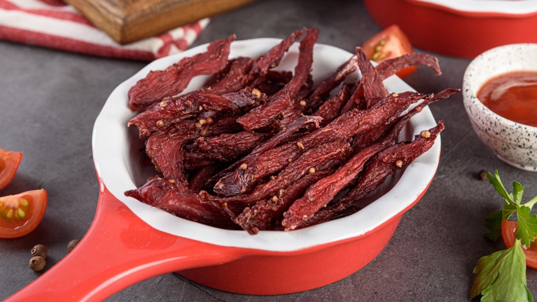 Beef jerky strips in a bowl