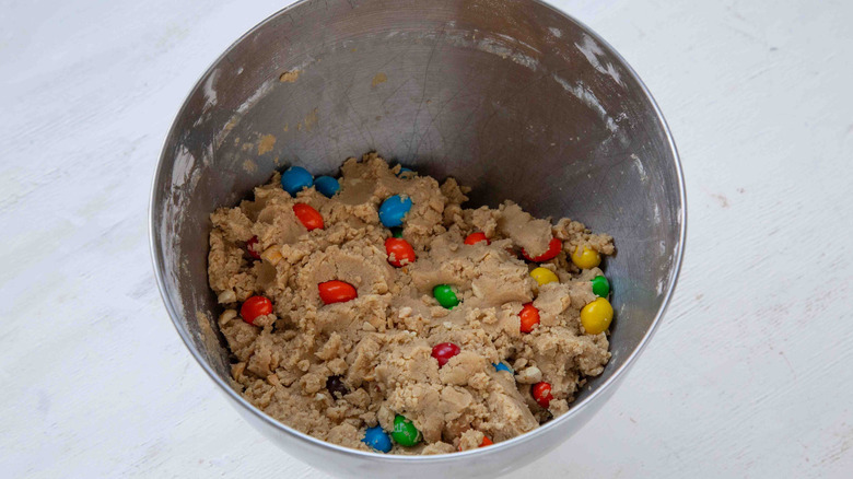 beige batter with M&M's in a metal bowl