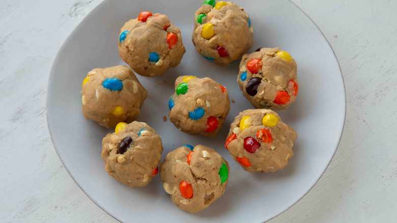 dough balls with M&M's in a white bowl