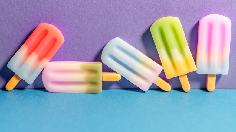 Colorful ice pops on a purple and blue backdrop