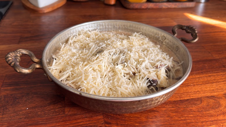 cooked basmati rice in a metal plate on a wooden table