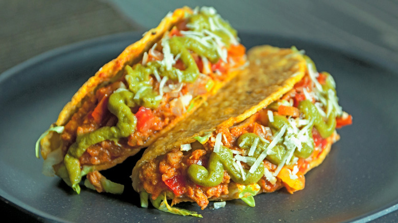 hard shell beef tacos on plate