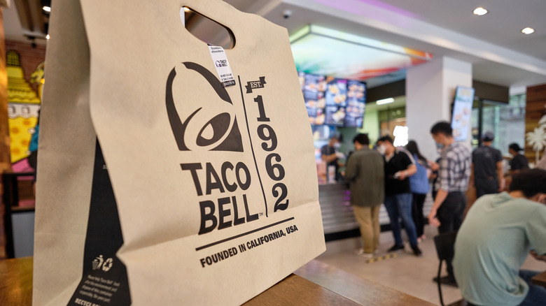 Taco Bell takeout bag in table
