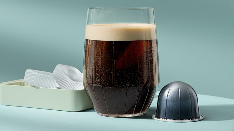 Nespresso Vertuo capsule with a glass of cold brew coffee