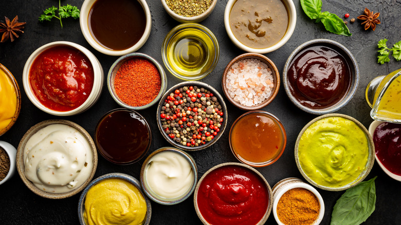 Variety of dipping sauces and seasonings in small bowls