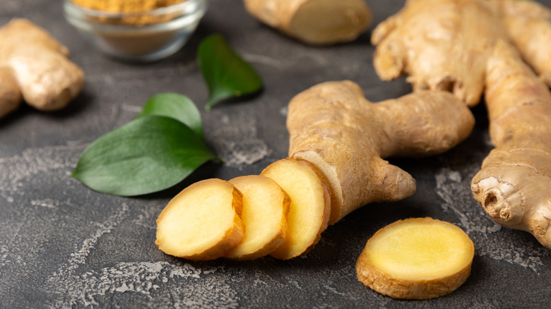 Fresh ginger root sliced with leaves