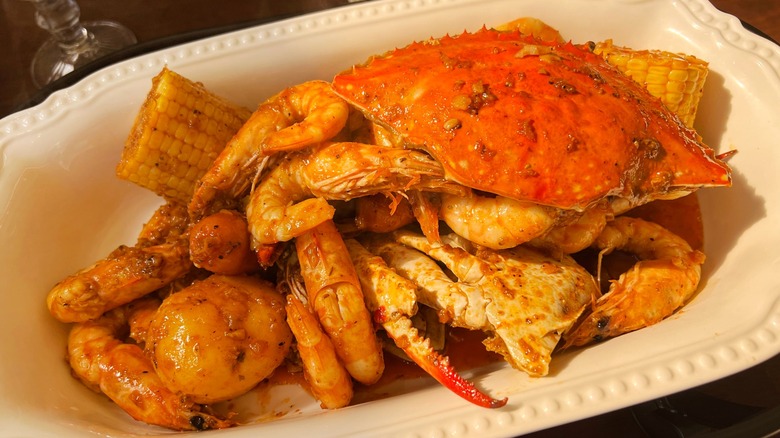 Seafood boil with crab, shrimp, potatoes, and corn