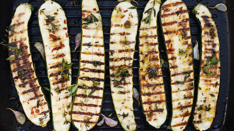 Grilled zucchini halves with herbs