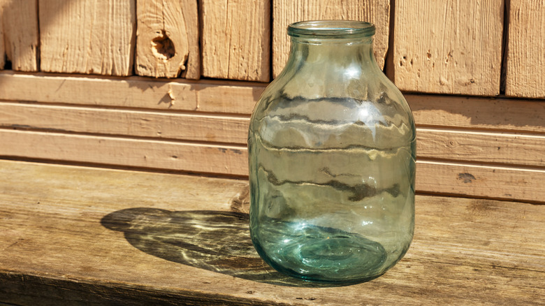 Empty glass jar drying out in the sun
