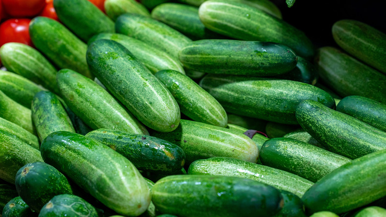 A pile of wax cucumbers at the grocery store