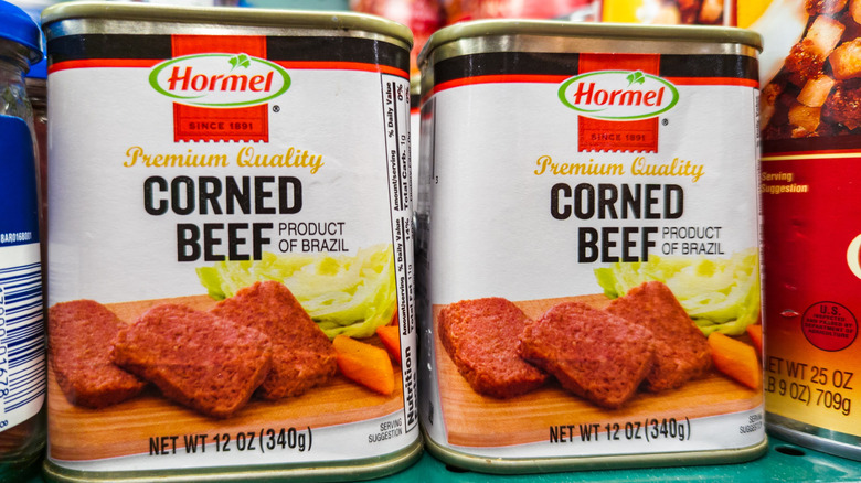 Hormel canned corned beef sits on a grocery store shelf