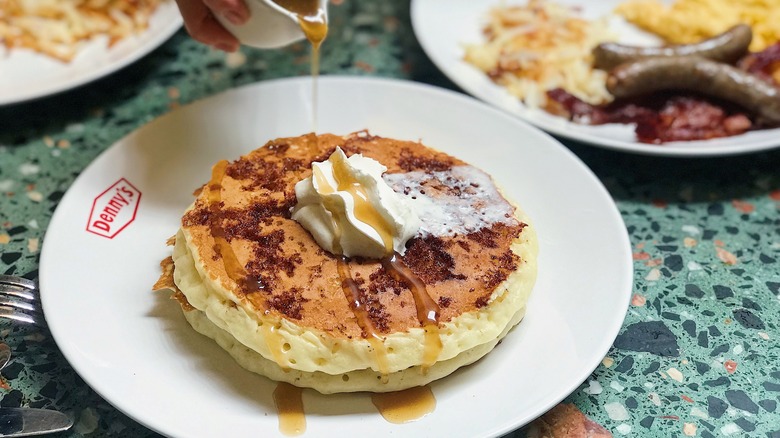 Denny's pancakes drizzled with syrup