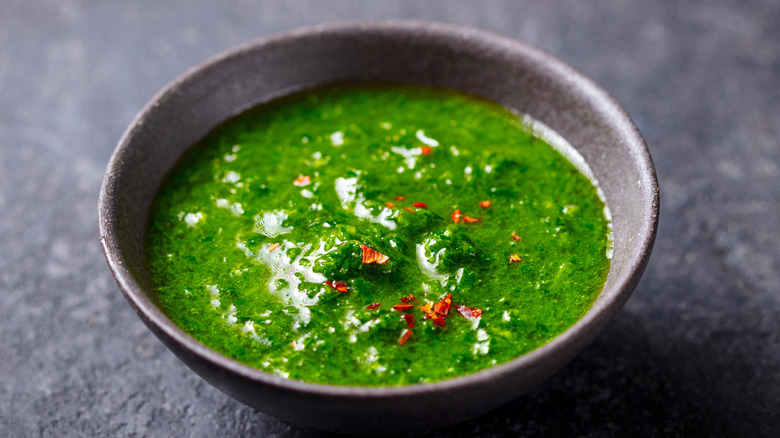 Chimichurri in a small grey bowl