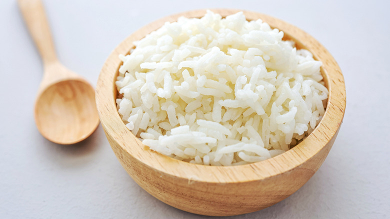 cooked white rice in wooden bowl