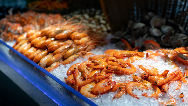 Frozen shrimp on ice in a display case