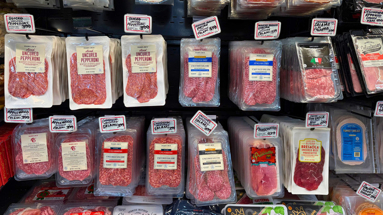 Various packages of cured meats, including salami, prosciutto, and pepperoni, at Trader Joe's