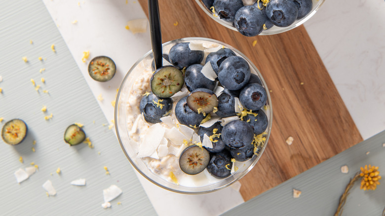 Top-view of yogurt with blueberries, lemon, and coconut