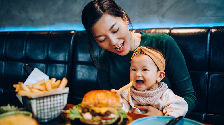 Young mother with her child at a restaurant