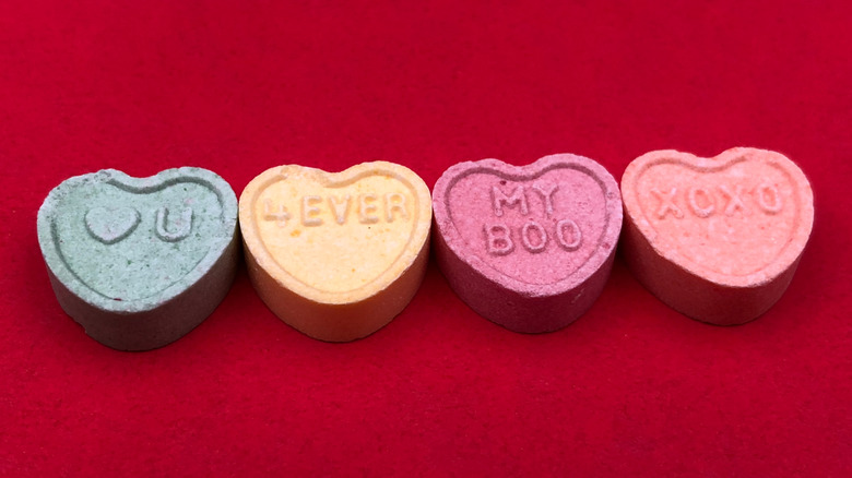 Conversation hearts on a red background