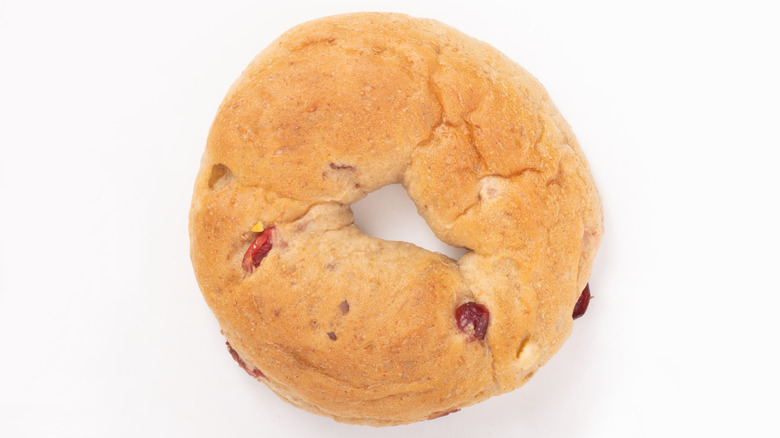 A cranberry bagel isolated on a white background