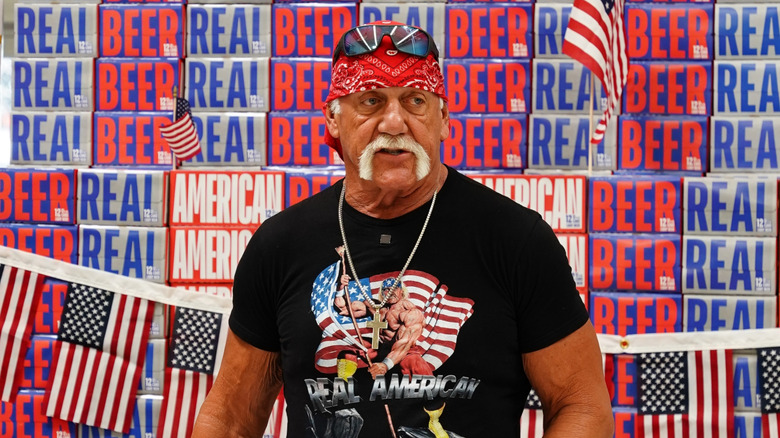 Hulk Hogan in front of cases of Real American Beer