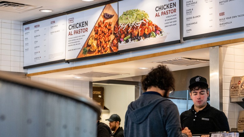 Person ordering at Chipotle Mexican Grill