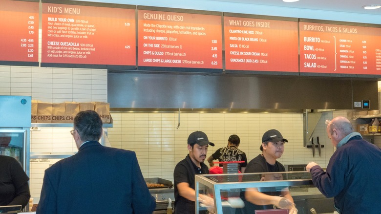 People ordering food at Chipotle Mexican Grill