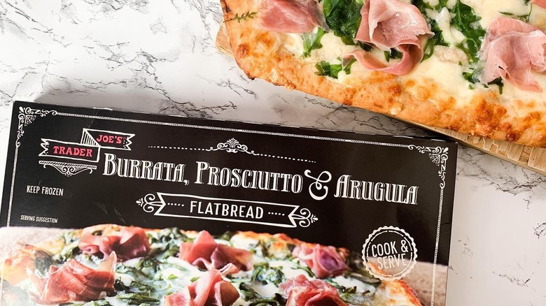 A picture of cooked flatbread and the box it came in.