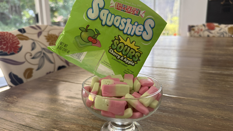 Smarties Squashies in glass bowl on wooden table