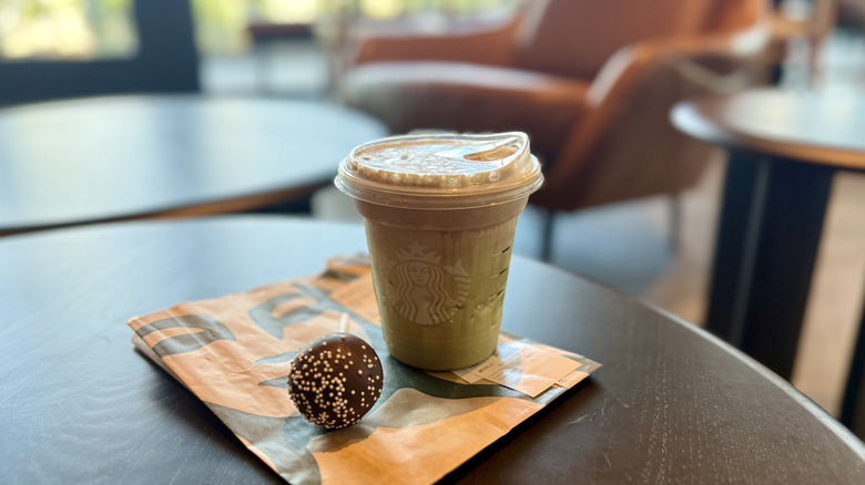 Iced Dubai Chocolate Matcha with a Chocolate Cake Pop