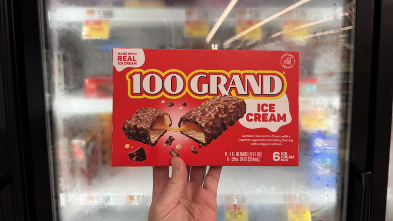 Hand holding a box of 100 Grand Ice Cream Bars
