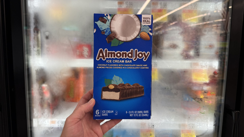 Hand holding a box of Almond Joy Ice Cream Bars