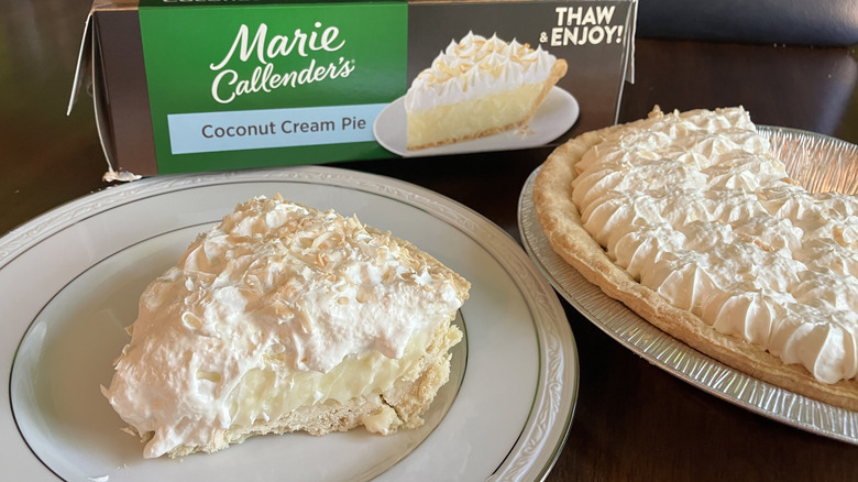 A slice of Marie Callender's Coconut Cream Pie next to the rest of the pie in its tin