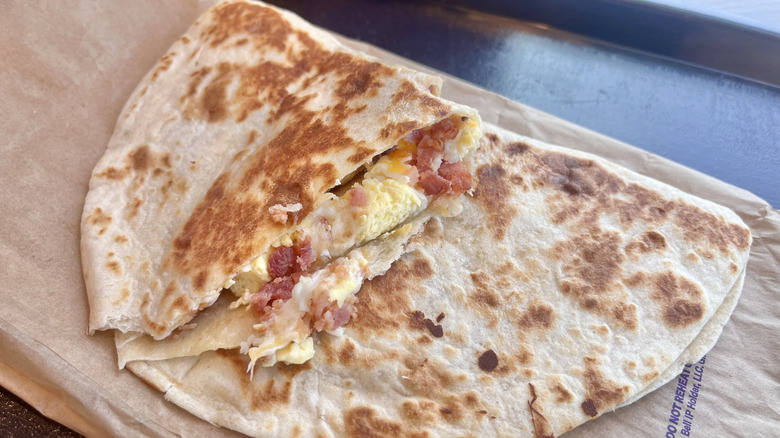 Breakfast Quesadilla Bacon on a paper wrapper