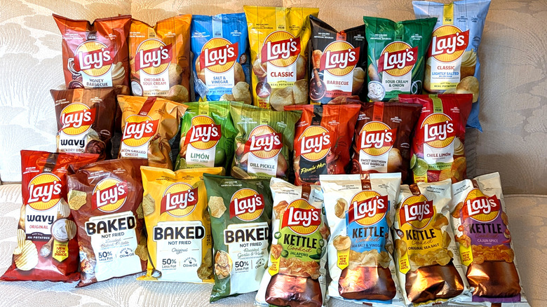 A display of 22 bags of differently flavored Lay's potato chips