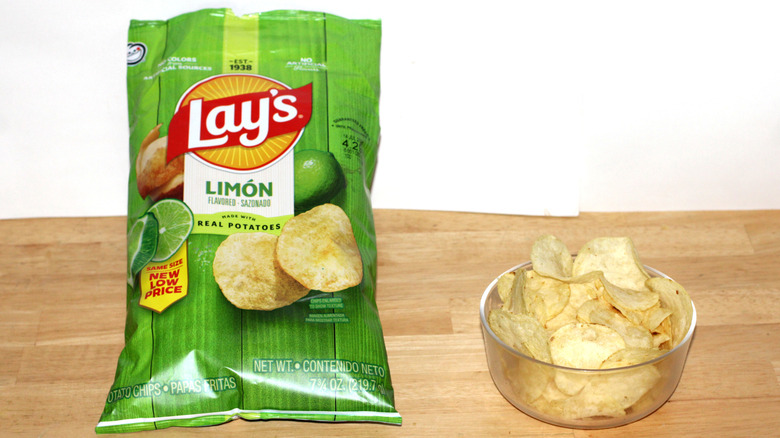 A bag of Lay's Limón potato chips beside a bowl full of chips